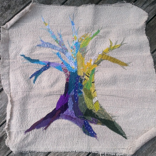 Blue/yellow scrap tree. 38x38cm. Appliqued fabric and machine embroidery on cotton. £30 ono